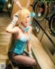 A woman in a bunny costume posing in front of a washing machine.