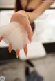 A woman is washing her hands with foam. 