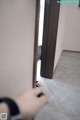 A person is opening a door in a room.