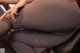 A close up of a woman's butt on a chair.