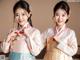 A couple of young women dressed in traditional Korean clothing.